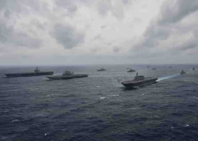 Carriers from the Indian navy, Japan’s Maritime Self-Defense Force and the US Navy sail in formation during exercise Malabar 2017. (US Navy/Twitter)